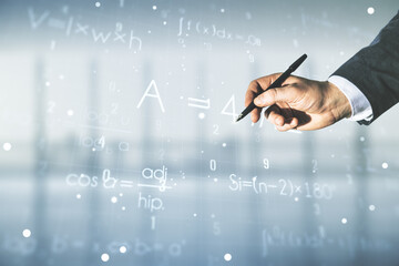 Man hand with pen working with scientific formula hologram on blurred classroom background, research concept. Multiexposure