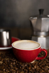 a cup coffee and moka with milk jug