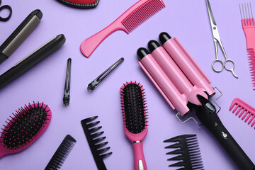 Flat lay composition of different professional hairdresser tools on lilac background