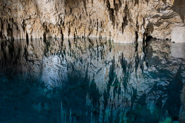 Cenote cave lake, Chichen Itza, Mexico. Cenote Zapote. Natural sinkhole pond with crystal clear water.