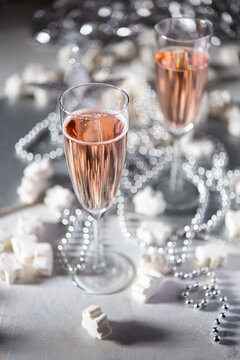 A couple celebrating with sparkling rose wine