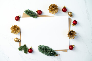 Fototapeta na wymiar Mockup for a letter or a Christmas invitation with gold fir cone 
