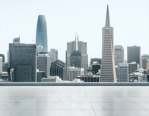 Fototapeta premium Empty concrete rooftop on the background of a beautiful San Francisco city skyline at sunset, mock up