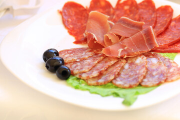 plate of cold meats on the table