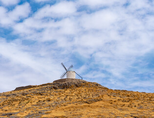 Windmills in the town of Consuegra de Toledo on a summer afternoon.