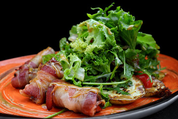 Meat stuffed rolls, baked potatoes and salad