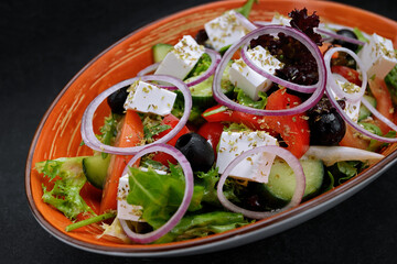 Greek salad with cheese, vegetables and olives