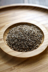 Cumin seeds in a wooden plate