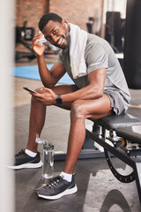 Fitness, phone and portrait of a man at gym for training, exercise and cardio while texting or...