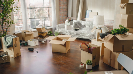 Establishing shot of a Moving In New Apartment. Real-Estate for Happy Family Sweet Home. Packed Cardboard Boxes, Furniture, Cozy Neibhourhood Window View. Moving in, Moving Out Concept No People