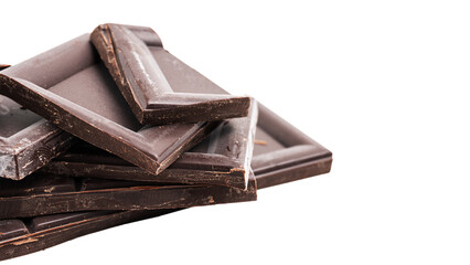 Dark chocolate pieces, cubes on a heap, broken chocolate isolated on white background