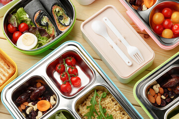Containers with healthy food on wooden background top view.