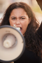 Woman, megaphone and protest in the city for human rights, gender based violence or equality in the...