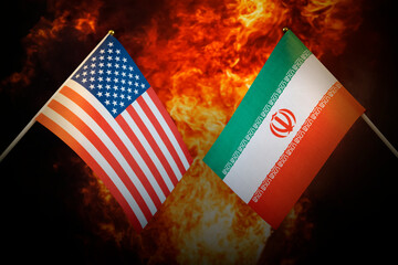 Flags of iran and United States of america against background of a fiery explosion. The concept of...