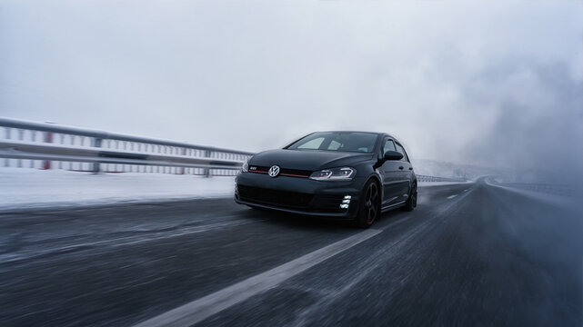 Helsinki, Finland - December 15, 2022 Volkswagen Golf Mk7 GTI on the road in snowy winter