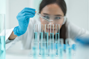 Scientist doing chemical test in research lab to study