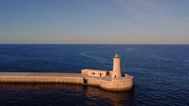 Valletta St. Elmo (Grand Harbour West Breakwater), drone close up shot, sunset time, Malta