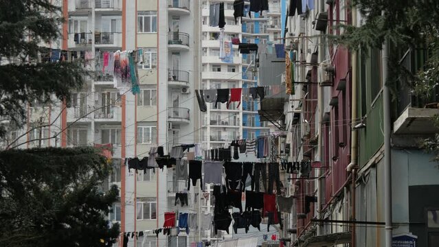 Clothes are dried on the streets of Batumi. A lot of laundry is dried on houses and balconies in Batumi. Life in Batumi.