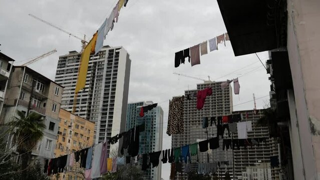 Clothes are dried on the streets of Batumi. A lot of laundry is dried on houses and balconies in Batumi. Life in Batumi.