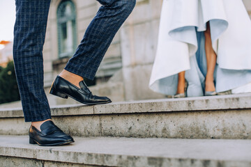 bride and groom in front of city hall