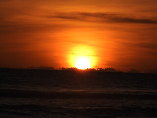 Fototapeta na wymiar Zoom of sunset at Melasti Beach, Bali, Indonesia