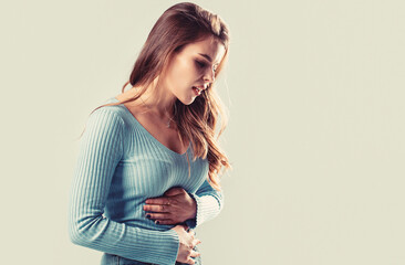 Girl having a stomachache. Young woman suffering from abdominal pain. Woman Stomach Ache