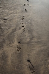 Human traces, tracks, foot, feet on the beach. Puerto del Carmen, Lanzarote Canary Islands