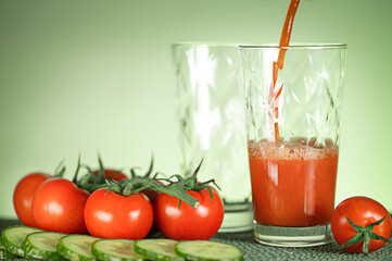Tomato juice from fresh tomatoes with cucumbers. Healthy food. Vegetarian drink.