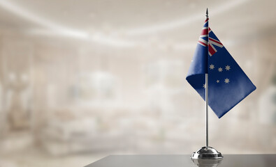 Fototapeta premium A small Australia flag on an abstract blurry background