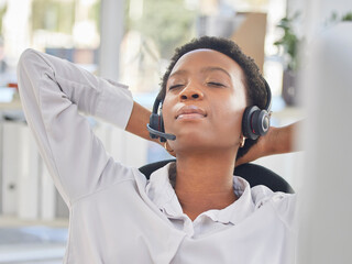 Black woman, call center and relax by consultant in office on break, nap or rest while working in...