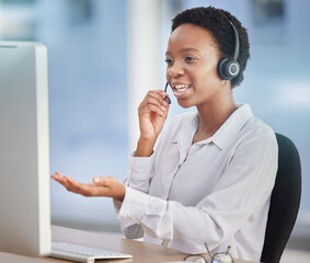 Black woman, customer support staff and call center employee working at desk of an online...