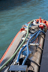 Obraz premium Close-up of a small Venetian residual sewage removal boat in a canal in Venice, Italy