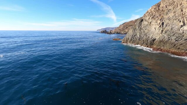 A fast, low flying perspective over the rocky coastline of Catalina Island. Helicopter GoPro footage. Longer segments may be available upon request.  	