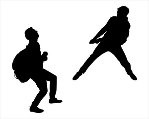 Silhouette of two men climbing a mountain by helping each other. A tourist pulls another tourist from below. Team building concept. Side view, profile. Two black silhouettes of men isolated