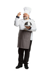 Portrait of bearded man, restaurant chef in uniform posing with plate and delightful face isolated on white background. Serving dish