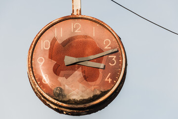 Old broken clock at abandoned industry