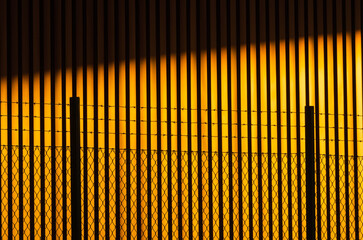 Fence in front of golden building