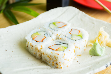 Surimi uramaki sushi roll in a Restaurant in Tokyo.