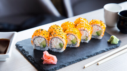 Surimi uramaki sushi roll in a Restaurant in Tokyo.