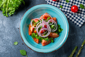 Tomato salad with red onion top view