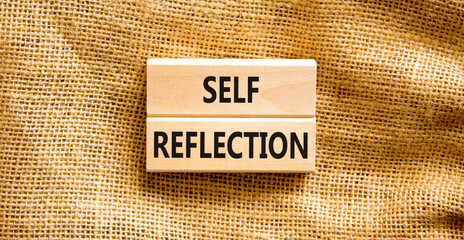 Self reflection symbol. Concept word Self reflection typed on wooden blocks. Beautiful canvas table canvas background. Business psychological and self reflection concept. Copy space.