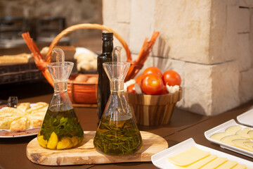 Flavored olive oils inside glass containers with dispensers