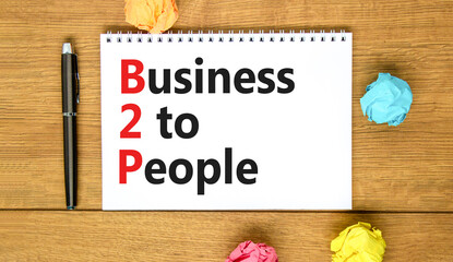 B2H business to people symbol. Concept words B2H business to people on white white note on a beautiful wooden background. Business and B2H business to people concept. Copy space.