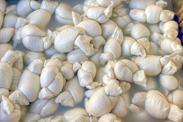 Tray of knots, a type of mozzarella from Puglia, Southern Italy