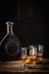 Whiskey with ice in glasses