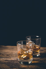 Whiskey with ice in glasses