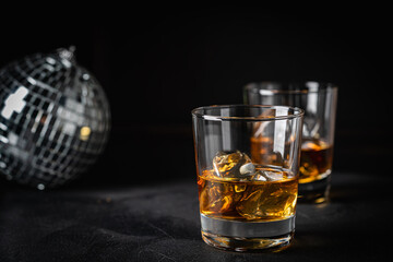 Whiskey with ice in glasses