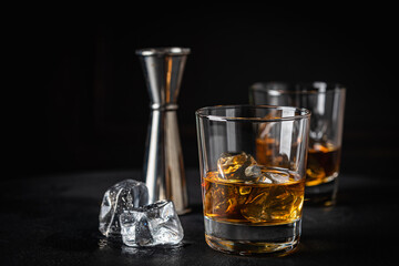 Whiskey with ice in glasses