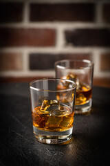 Whiskey with ice in glasses
