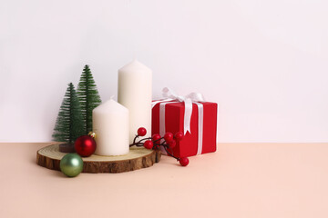 Christmas festival setup with gift boxes, candles, ribbons, jingle balls, Christmas tree. Mock up Christmas setup on white background.